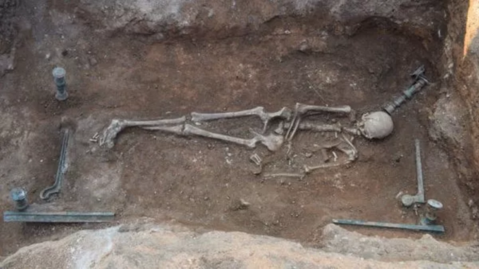 2100-year-old burial of woman lying on bronze 'mermaid bed' unearthed in Greece